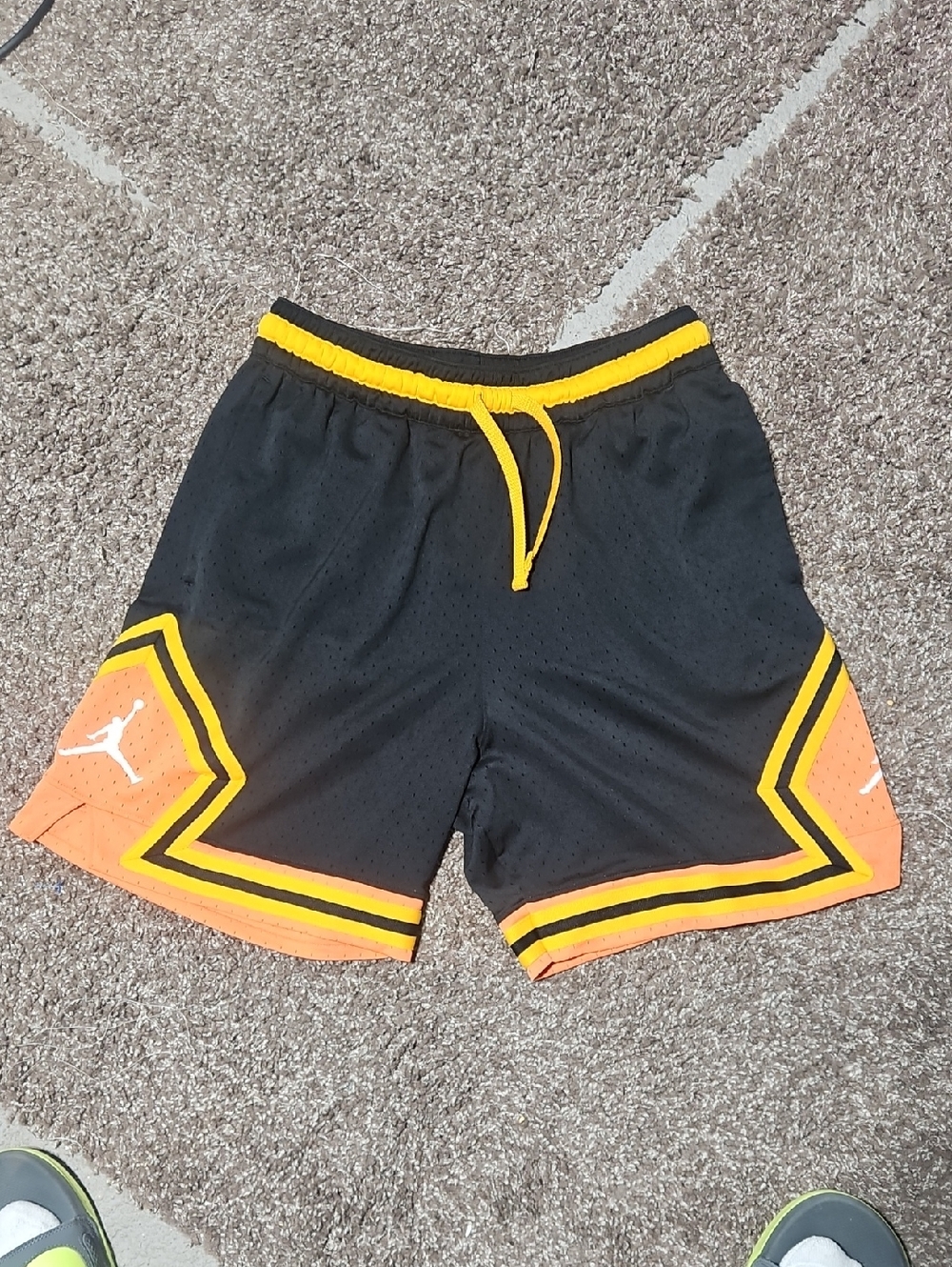 Jordan Black Basketball Shorts with Orange Panels and Yellow Trim